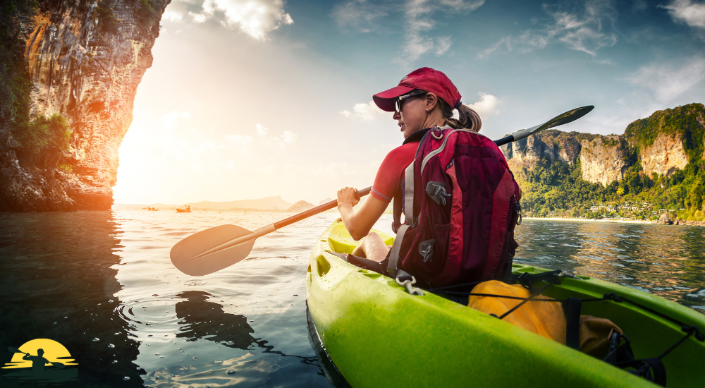 A lady kayaking in a lake