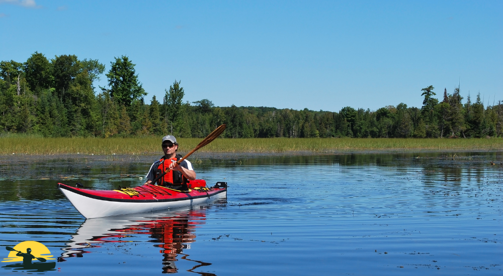A man kayaking in a lake