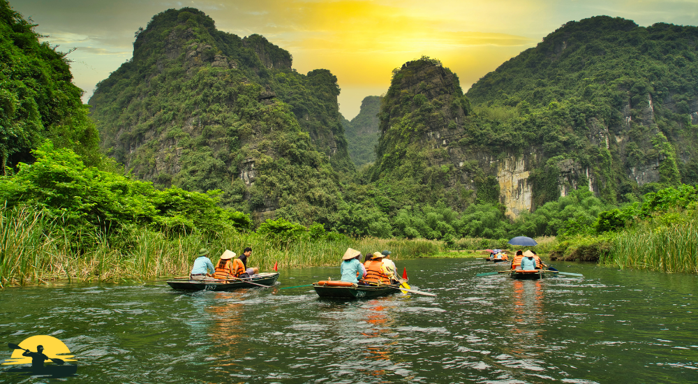 People are kayaking besides mountain