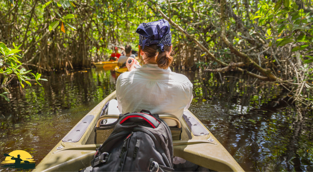 kayaking in forest side lake