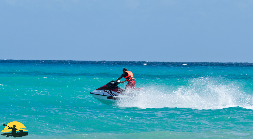 A man is riding a jet ski