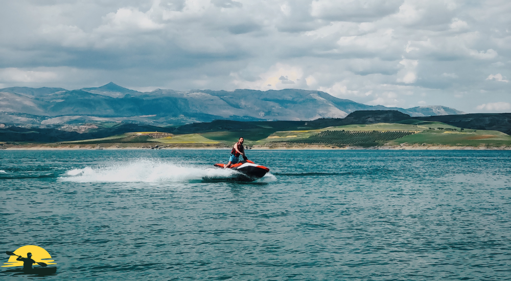 A man is riding jet ski on the sea 