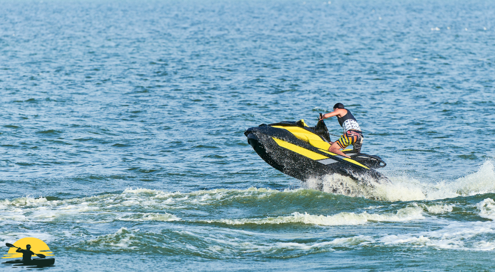 A man is riding a jet ski
