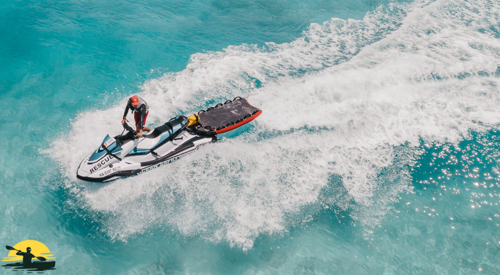 A man is riding a jet ski on the water