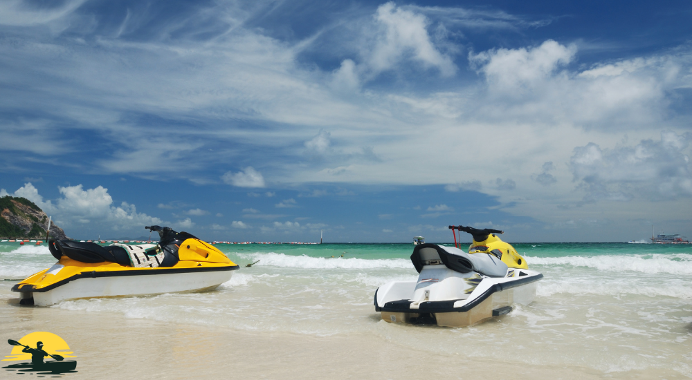 two jet ski besides the beach