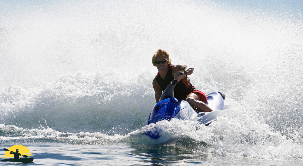 A man is riding a jet ski