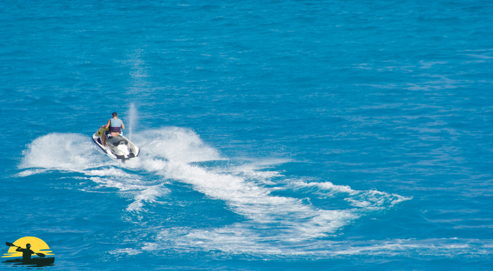A man is riding a jet ski