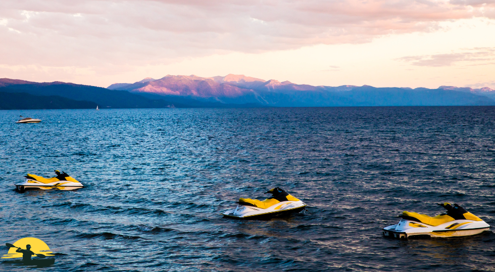 some jet skies are on the sea 