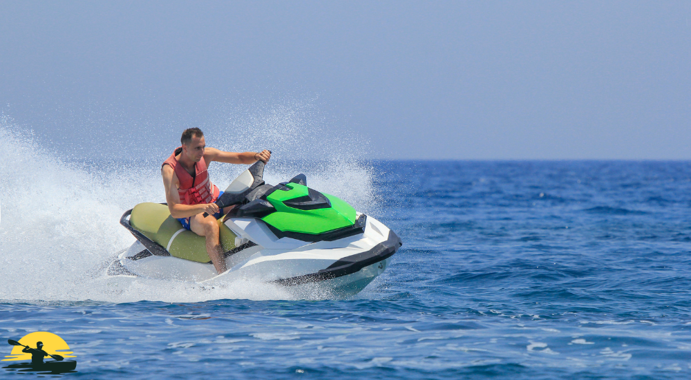 A man is riding a jetski on the water