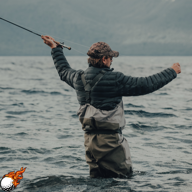 A man is wearing a wader and fihsing