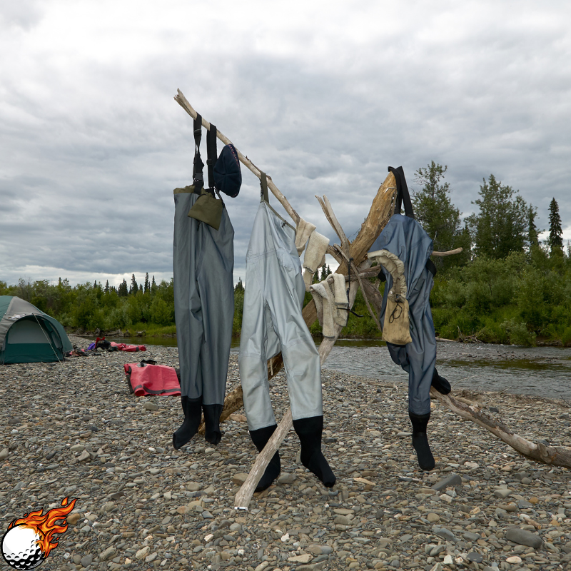 Some waders are hanging on the bamboo
