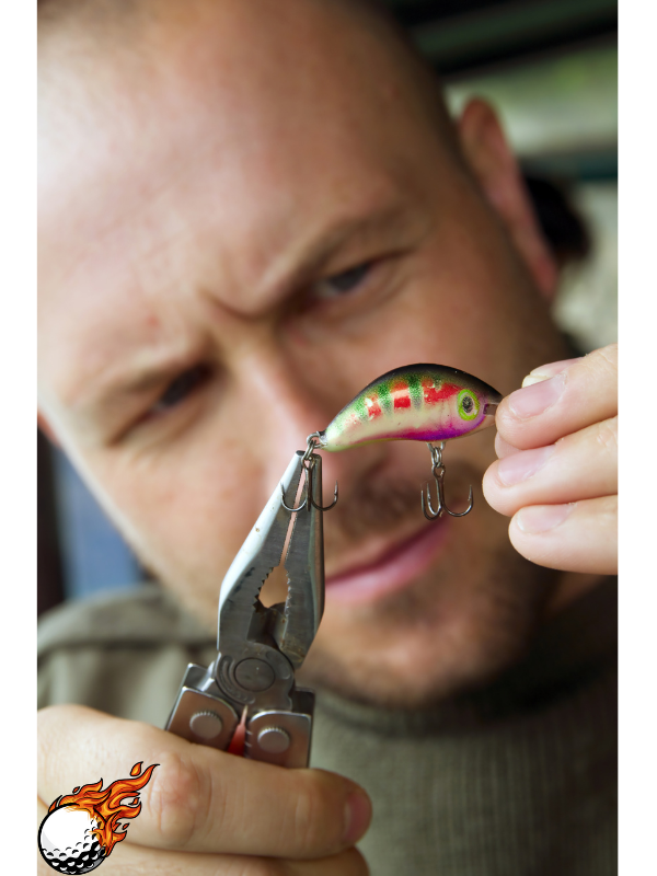 A man is holding a fish with pliers 