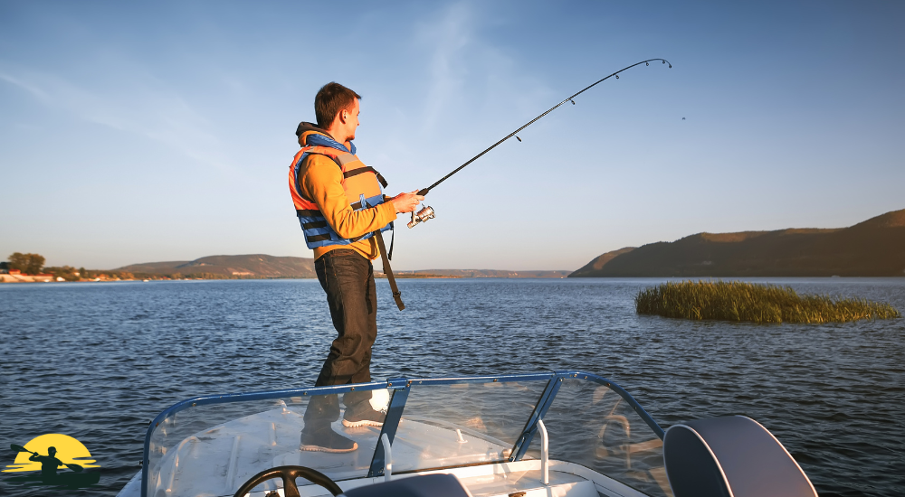 A man is fishing in a lake