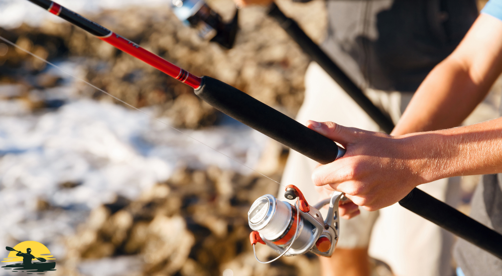 A man is holding a fishing rod