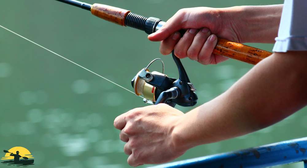 A man is holding a fishing rod