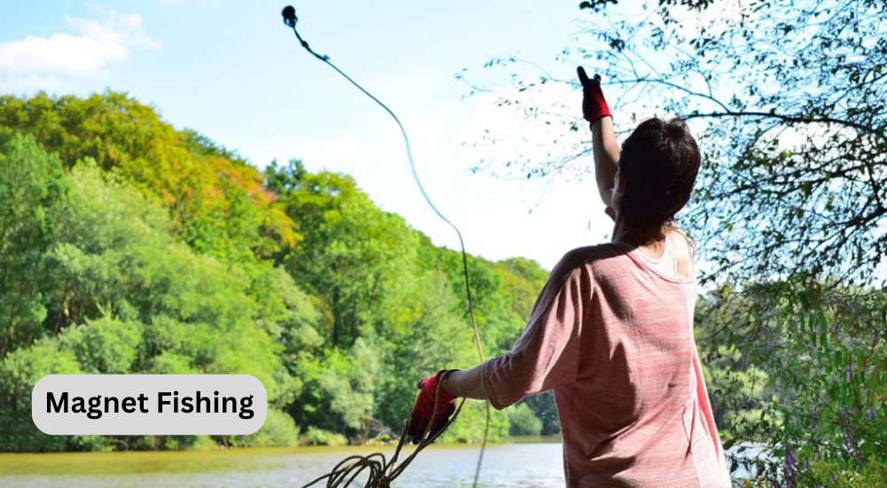 A lady is throwing fishing magnet at lake