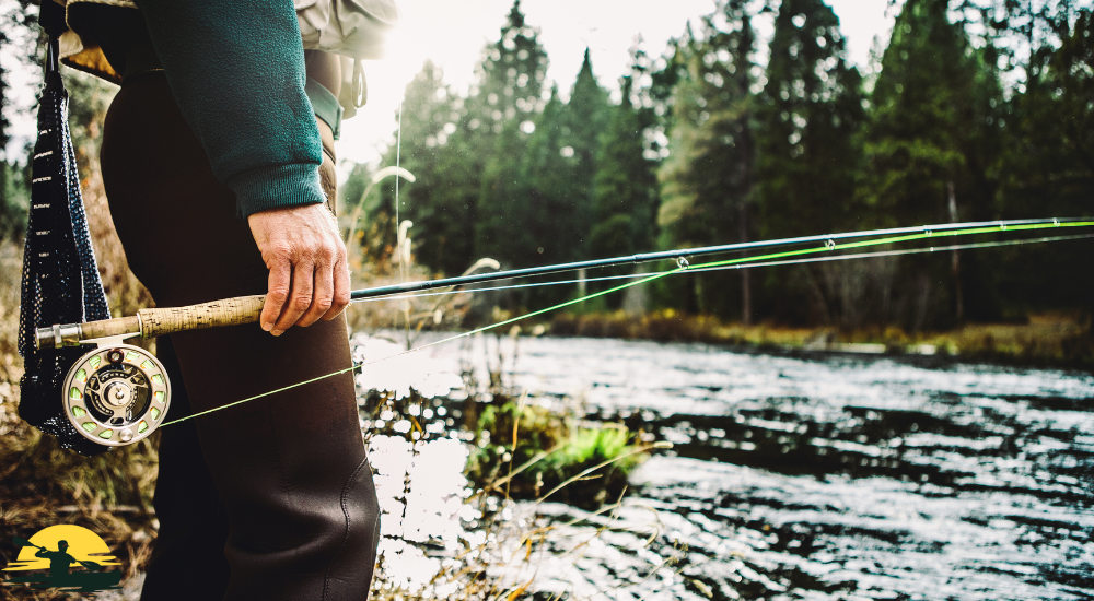 A man is fishing in a lake