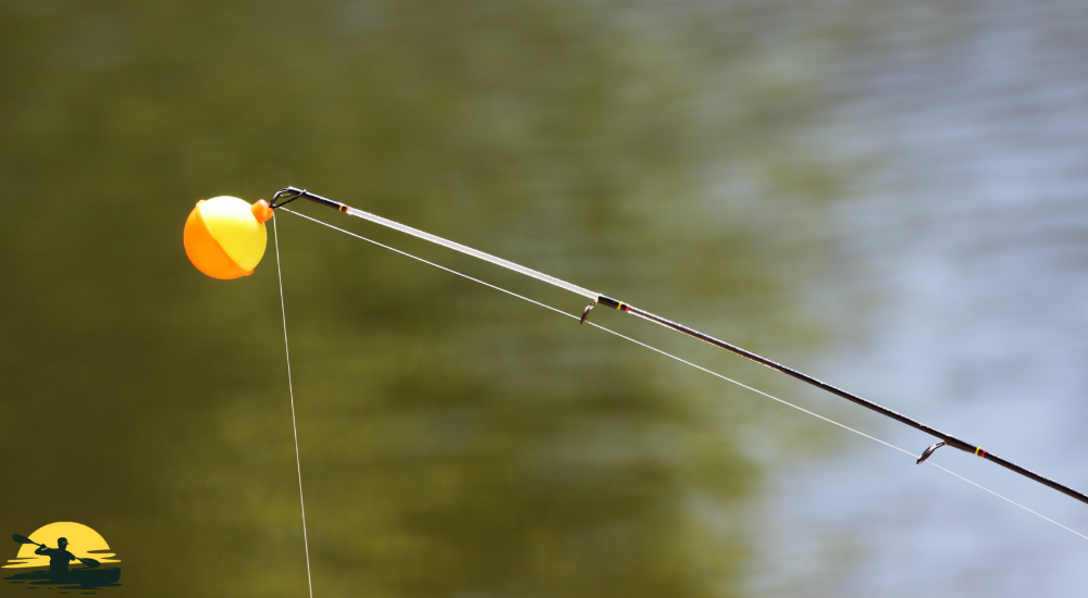 Fishing rod attached with bobber above the water