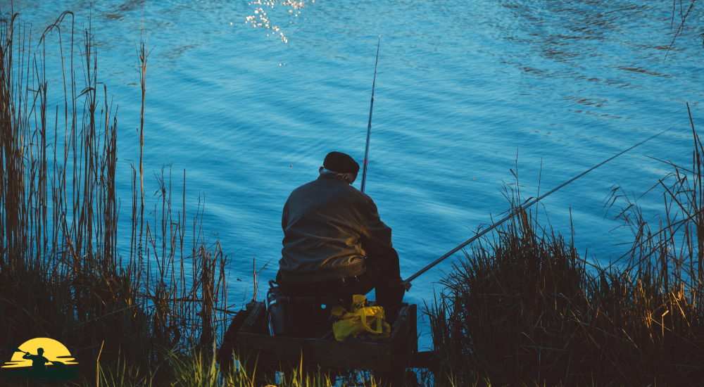 A man is fishing in a lake