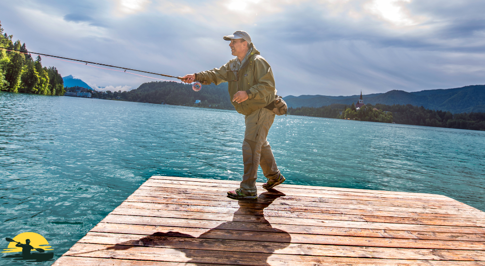 A man is casting a fishing rod on a riverside