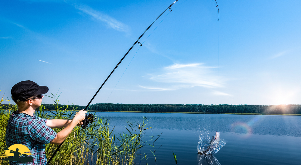 A man is fishing in a lake