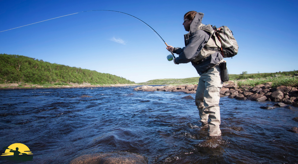 A man is fishing in a lake