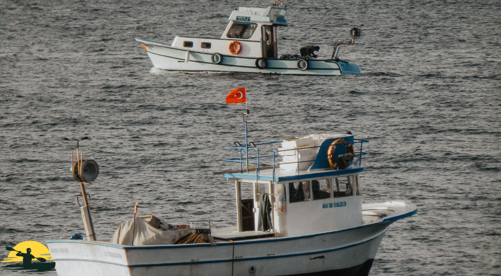 Two boats are crossing each other