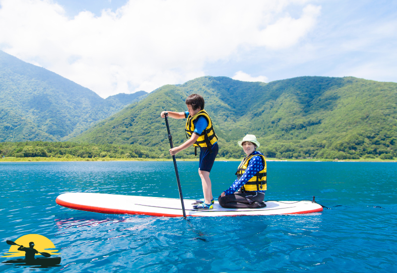 Two man is paddling a board